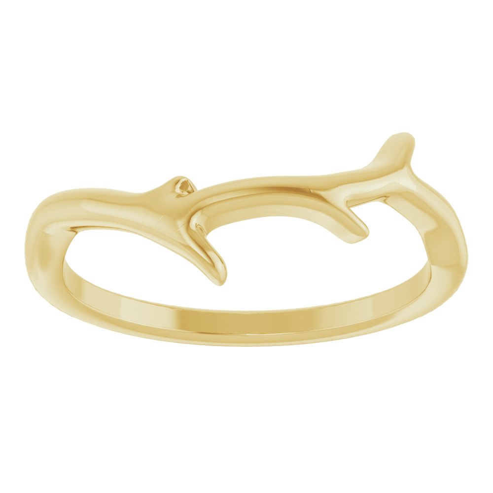 Gold ring with branch design on a white background