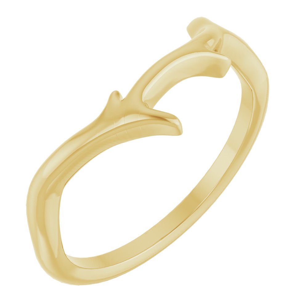 Gold ring with a branch design on a white background