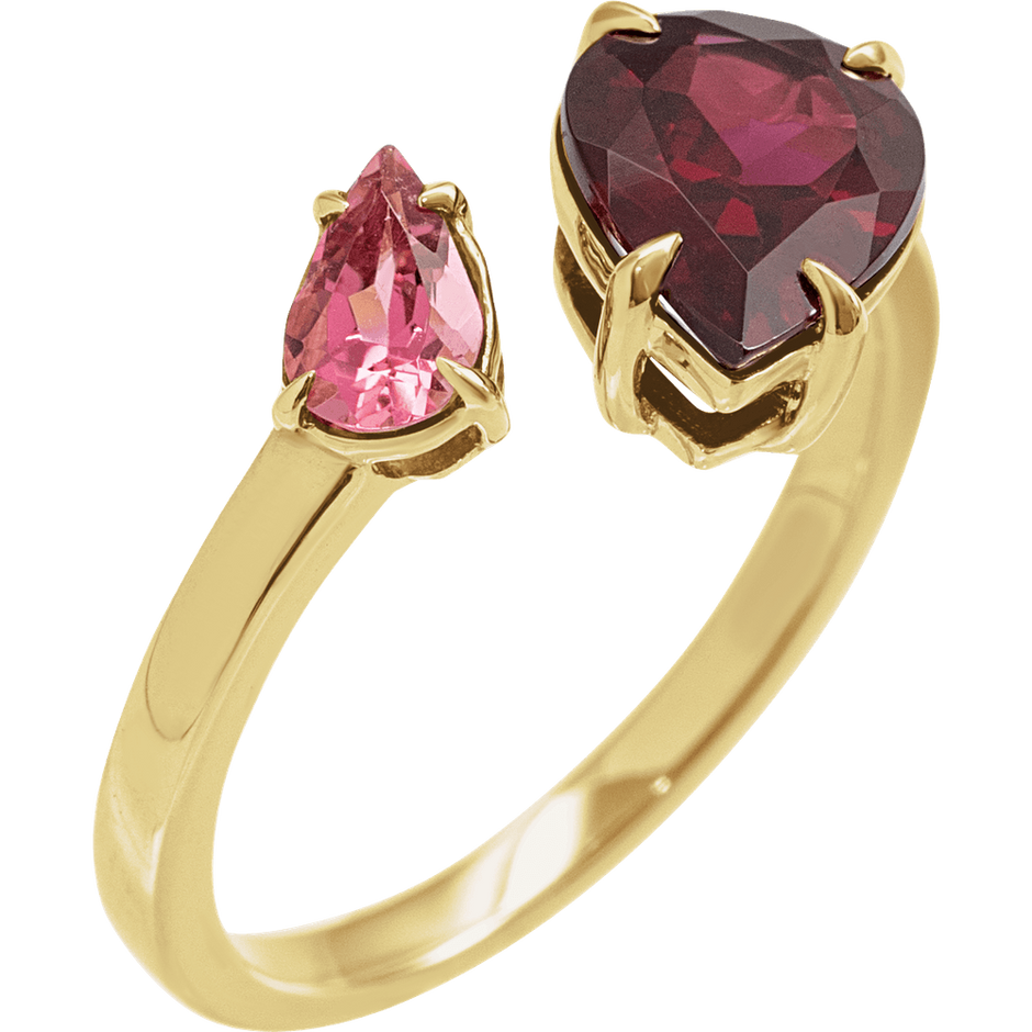 Gold ring with pink and red gemstones on a white background