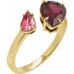 Gold ring with pink and red gemstones on a white background