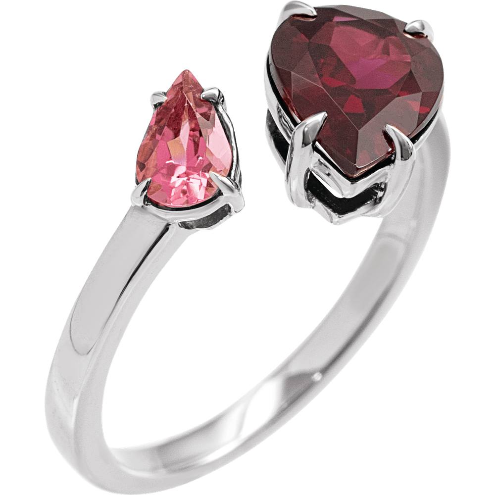 Silver ring with heart-shaped and pear-shaped pink gemstones on a white background