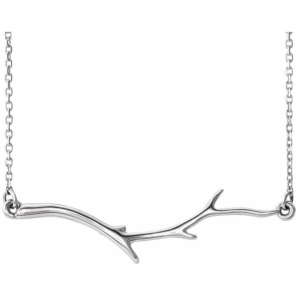 Silver branch-shaped necklace on a white background