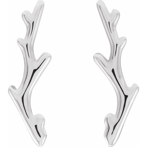 Silver branch-like earrings on a white background